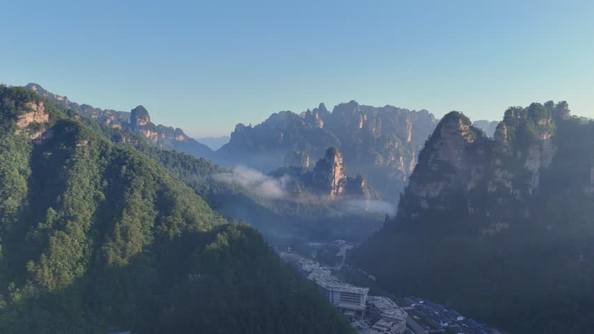 Pillar mountain formation in morning sunlight, Zhangjiajie South Gate, China, aerial