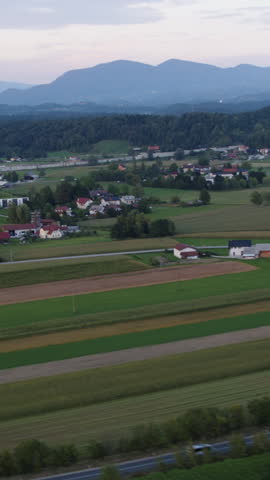 Aerial of town surrounded with hills and fields