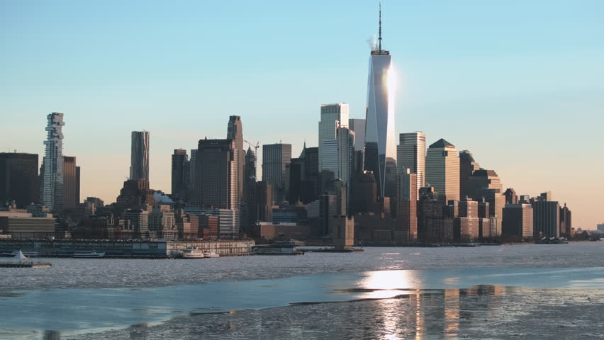 Aerial view of the Manhattan Financial District on a winter day. Shot along a frozen Hudson River.