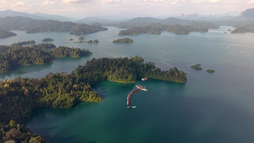 Experience the stunning landscapes of Khao Sok National Park in Thailand, with lush greenery, serene waters, and captivating islands. Nature's beauty awaits every traveler.