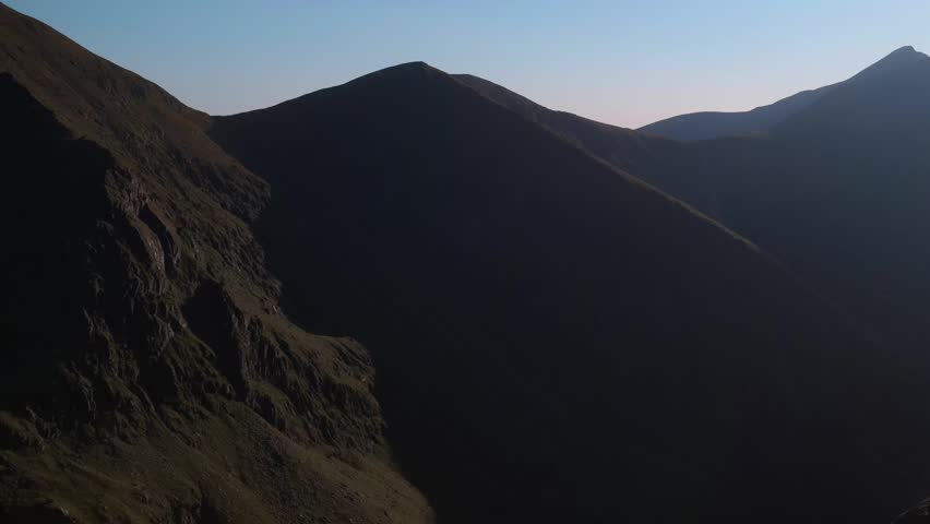Scenic landscape of layered mountains in distance.