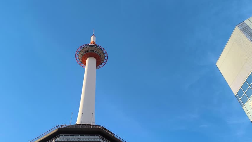 Kyoto Tower Low Angle View City Skyline Urban Landmark Japan, blue background