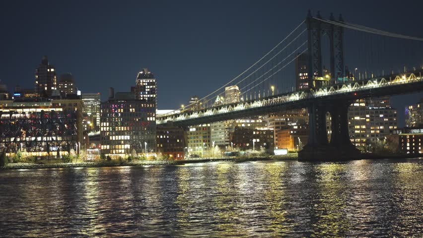 Manhattan Bridge And The Lower Manhattan Skyline From Across The East River At Night In New York City, USA. - wide shot