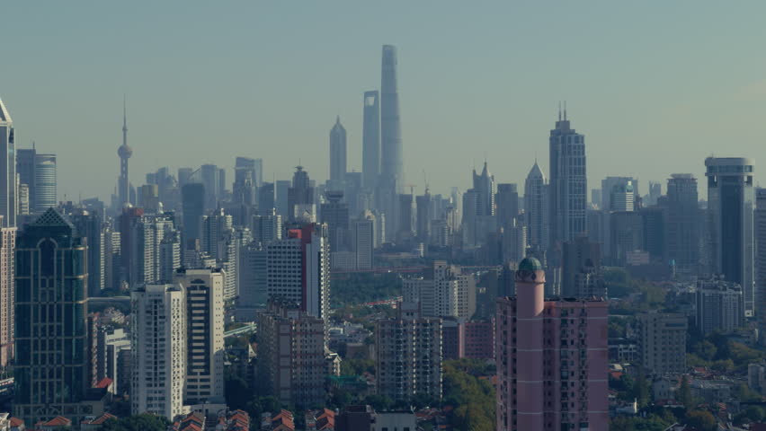 Shanghai city horizon filled with modern high-rise structures.