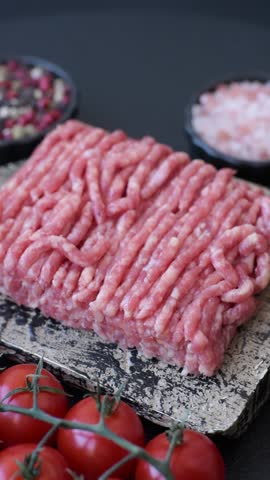 Raw ground beef or pork, prepared meat for burgers or other food preparation. Raw ground beef as a food background for your design
