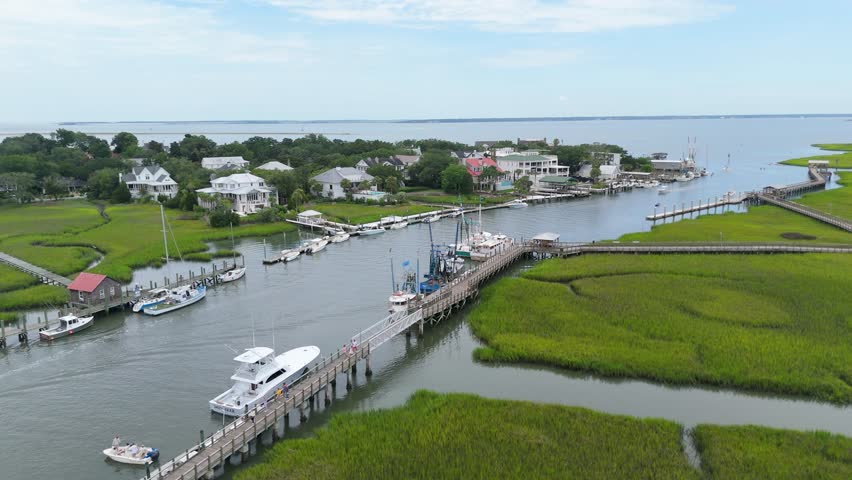 Static close up drone shot of boats docked in Shem Creek, SC.