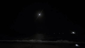 Moonlight over dark sea waves at night
Night seascape with bright moon in the sky, gentle waves on a dark beach and distant lights on the horizon, calm ocean under moonlight. - Powered by Shutterstock - Get 15% off with code: PIKWIZARD15