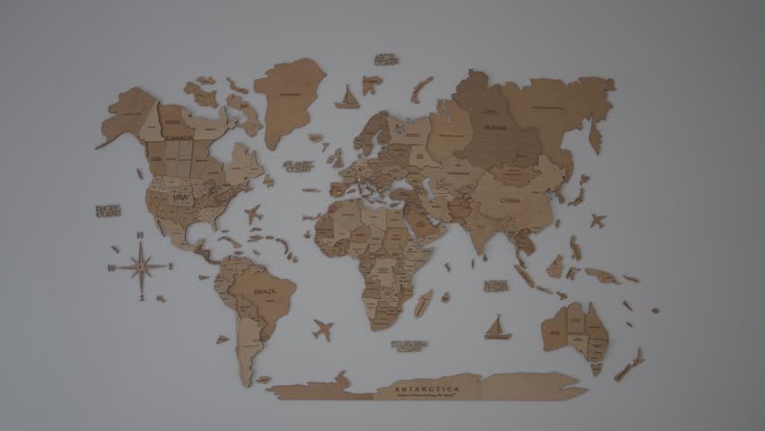 Wooden world map mounted on wall showing continents and country names