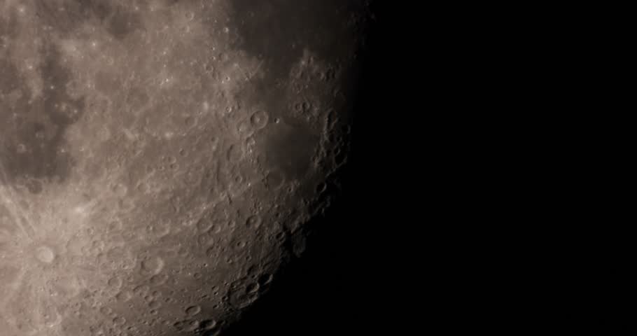 Huge detailed moon surface shot at 3000mm. Real time motion with atmospheric turbulence, static camera, black space, no people.