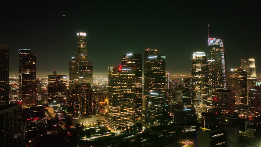 Los Angeles city night lights from drone. LA downtown timelapse. Los Angeles night aerial motion. Los Angeles city skyline at night. LA night cityscape video. Downtown Los Angeles lights.