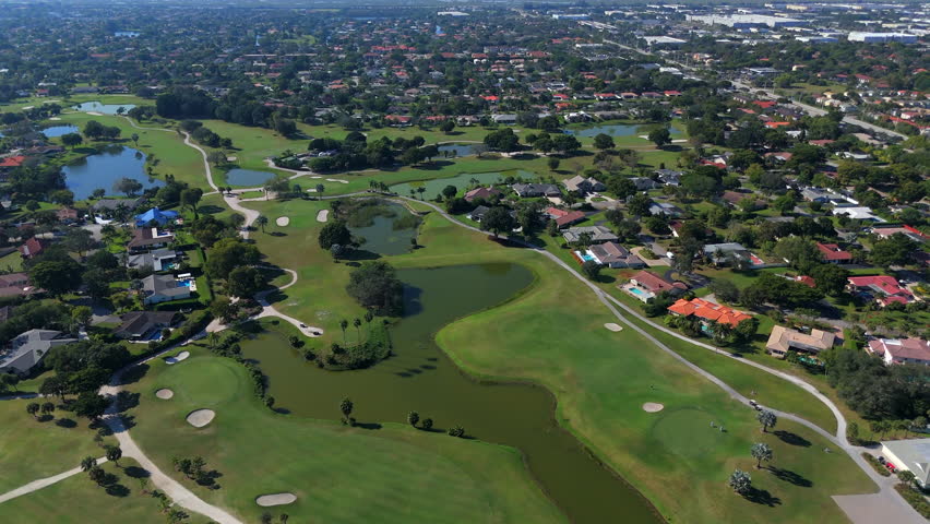 Coral Springs Florida golf course with fairway bunkers and homes
