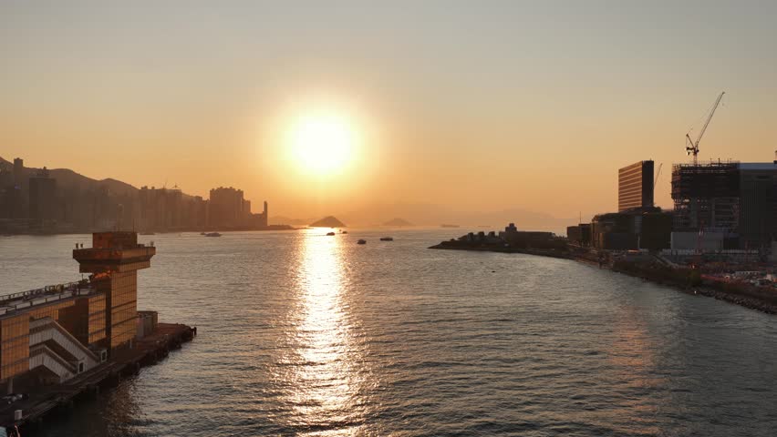 Golden sunset reflecting over hong kong