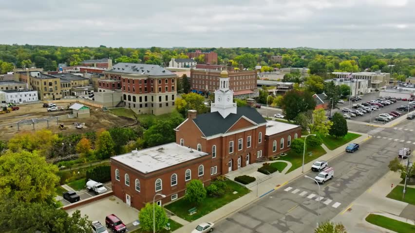 Aerial view of the historic courthouse in downtown Menomonie, Wisconsin, highlighting classic architecture surrounded by charming Midwestern streets.