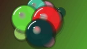 A group of shiny marbles in various colors rotating on a green surface - Powered by Shutterstock - Get 15% off with code: PIKWIZARD15