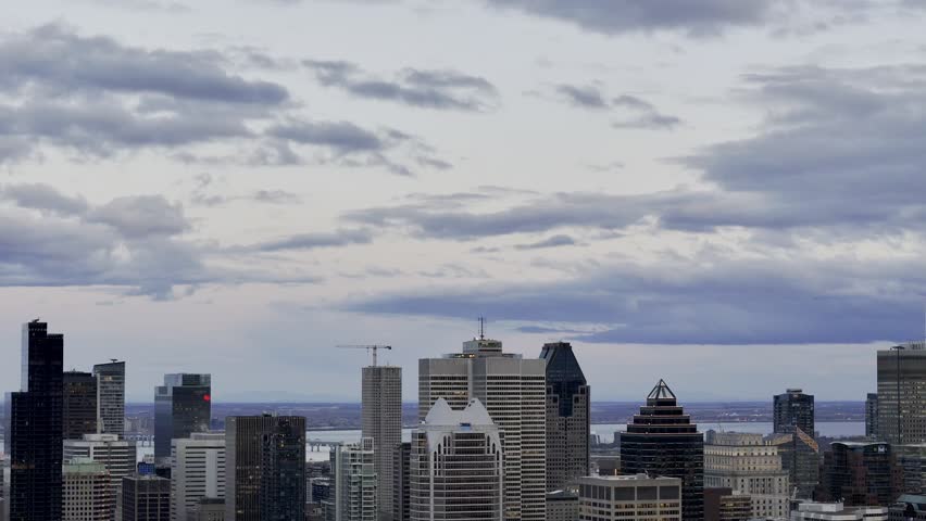 Cloudy Montreal City Skyline at sunset, Quebec, Canada.