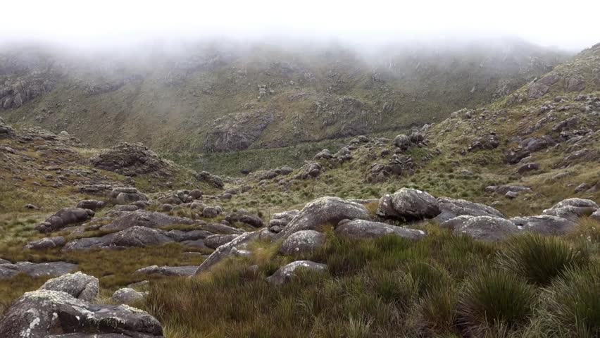 View of mountainous rock formation in high altitude area of Itatiaia national park under fog. Rio de Janeiro, Brazil