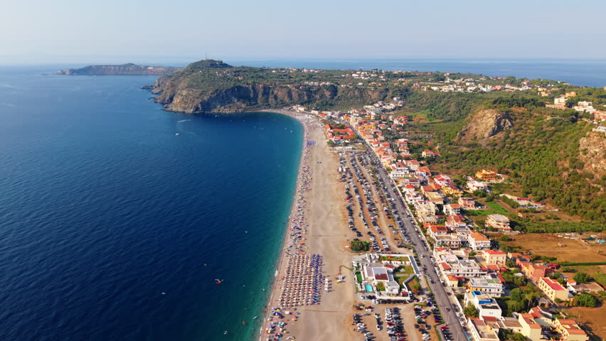 Aerial Flyover of Sicily Italy Beach Town, Waterfront vertical Landscape natural environment
