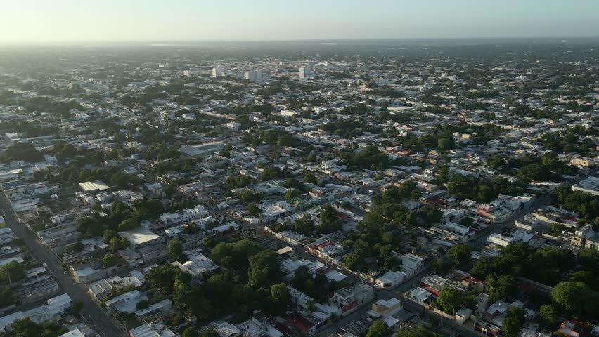 Aerial view of Merida, Mexico, showing cityscape and lush greenery
