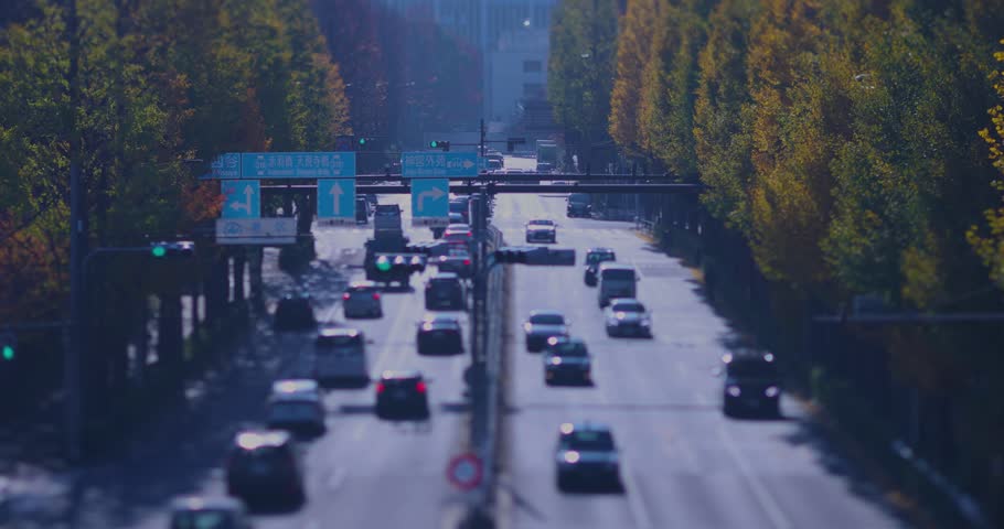 A cityscape of miniature traffic jam at the yellow gingko street in the city