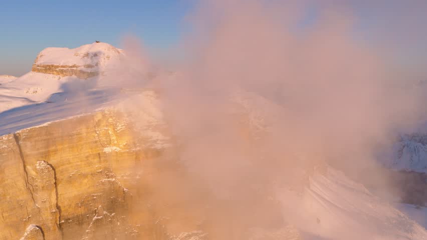 Foggy Clouds At The Summit Of Sass Pordoi, Peak In The Dolomites Mountain Range In Italy. Aerial Shot