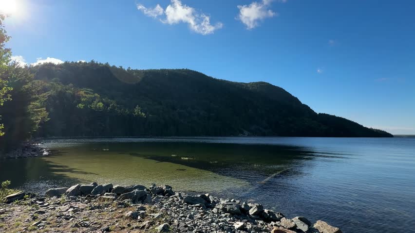 Long Pond lake in Acadia National Park with rocky shore and mountains