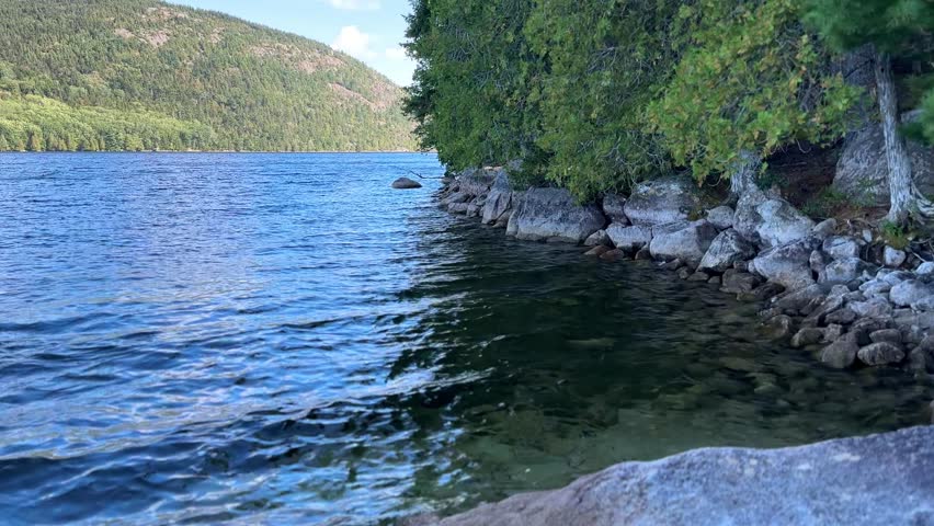 Long Pond lake in Acadia National Park with rocky shore and mountains