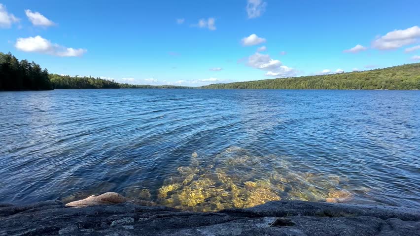 Long Pond lake in Acadia National Park with clear water and blue sky