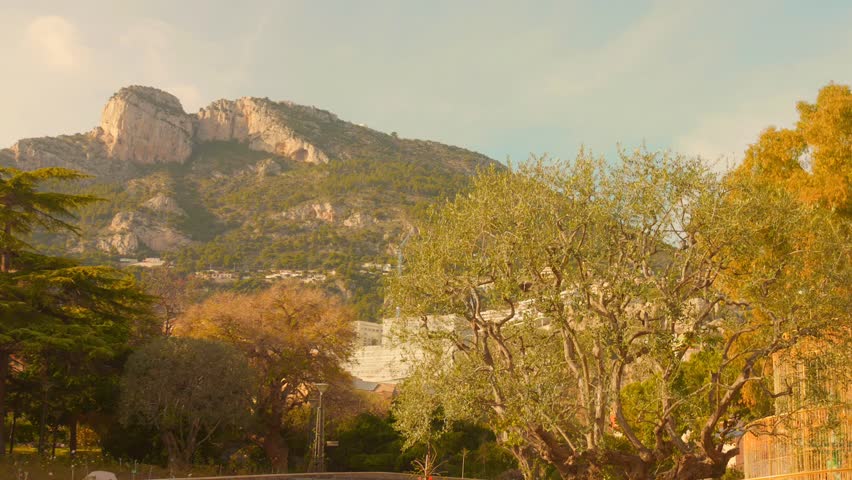 Monaco garden view with mountains, serene and scenic atmosphere