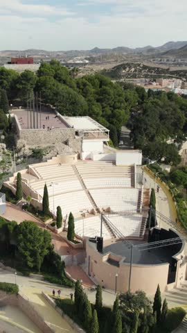 Torres Park auditorium in Cartagena, showing modern architecture and surrounding park area. Vertical aerial.
