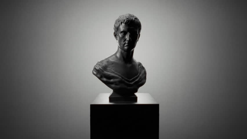 Contrasting monochrome bust shadows. High contrast black and white sculpture with textured surface. Cinematic noir style bust with deep shadows and angular highlights