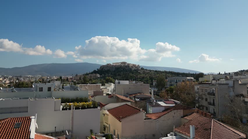 Aerial drone footage of the Parthenon on top of the Acropolis, the ancient citadel of Athens, Greece