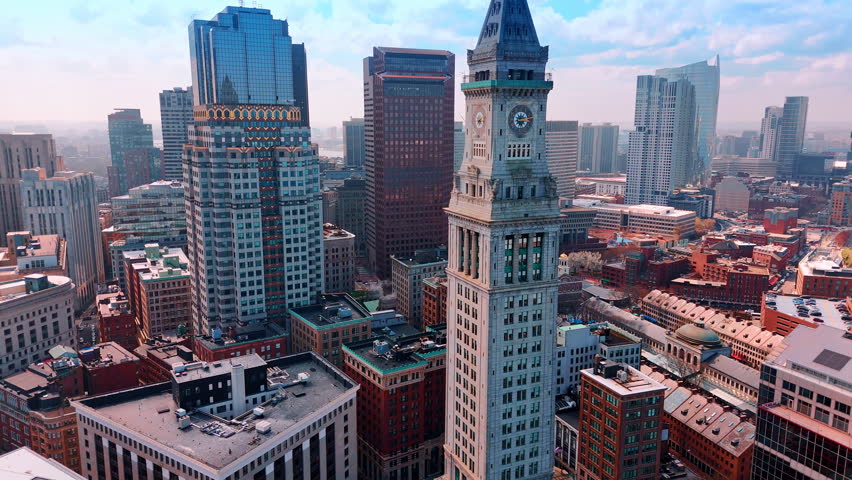 Flying closer to the Custom House observation deck. Aerial perspective on the stunning buildings of Boston, Massachusetts, USA.