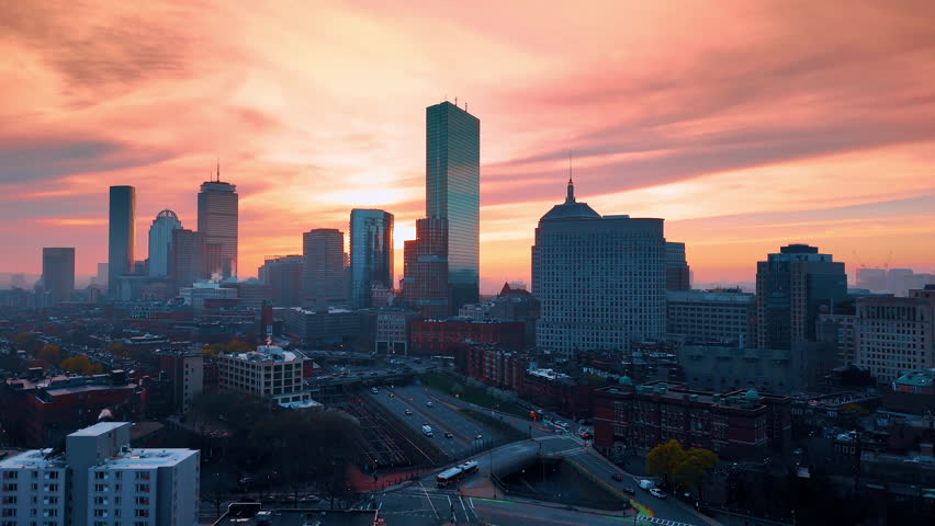 Amazing scenery of Boston skyline at sunset. Pink sky over the stunning cityscape. Top view.