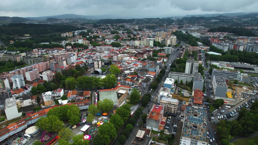 A panoramic aerial view around the old town of the city Vila Nova de Famalicao in Portugal on a cloudy spring noon