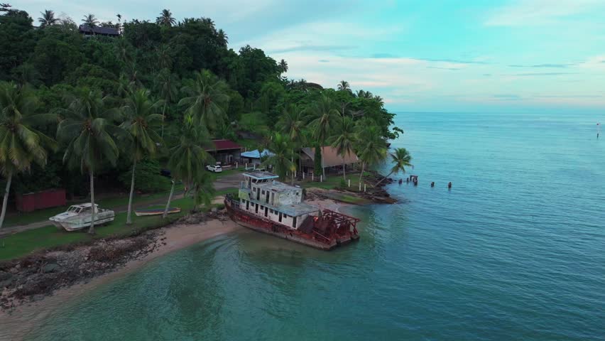 Wewak Hill Bay beached rusted fishing boat Boram Road Sea Wall Meni Boram Beach Wewak Papua New Guinea PNG Papua Niugini pier harbor view landscape Sepik Province coastline Bismarck Sea upwards motion