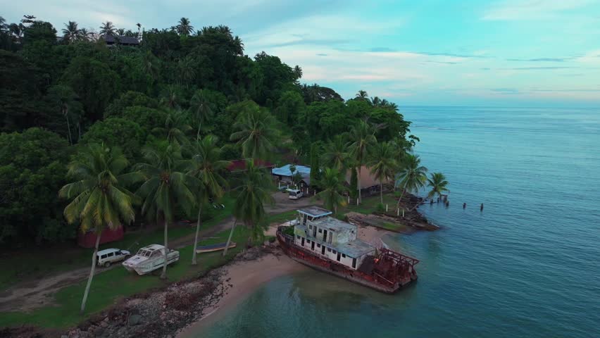 Wewak Hill Bay beached rusted fishing boat car Boram Road Sea Wall Meni Boram Beach Wewak Papua New Guinea PNG Papua Niugini pier harbor view landscape Sepik Province Bismarck Sea circle right