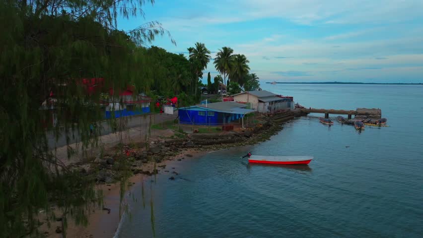 Wewak Hill Bay canoe boat ship yard Boram Road Sea Wall Meni Boram Beach Wewak Papua New Guinea PNG Papua Niugini pier harbor view landscape Sepik Province Bismarck Sea upwards motion