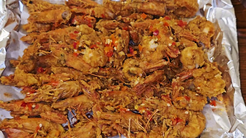 The deep fried shrimps or prawns to a crispy texture, mixed with a spicy sauce and lemon, shrimps could be prepared in various cuisines, seafood concept