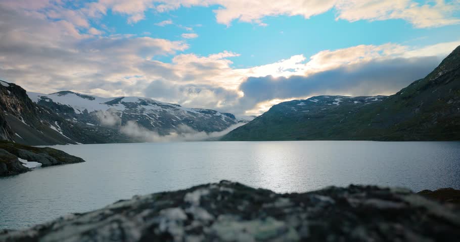 Sunset against the backdrop of the Norwegian mountains. Beautiful Nature Norway natural landscape.