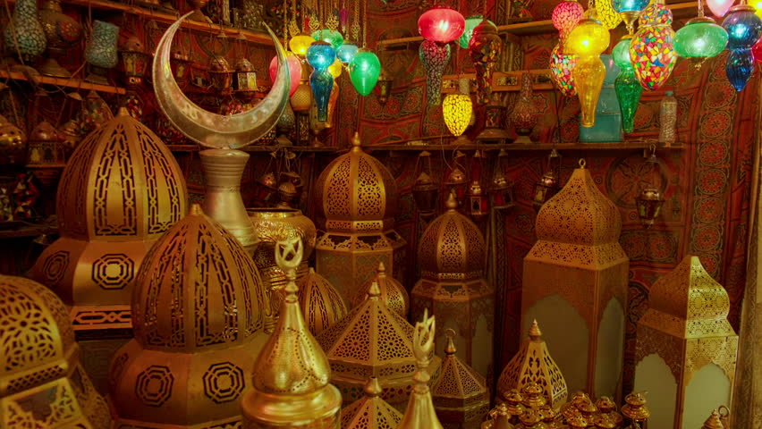 Vibrant Middle Eastern souvenir shop filled with hanging mosaic lanterns, glass lamps and brass decor. Traditional middle eastern lanterns at Khan El Khalili market in Cairo, Egypt