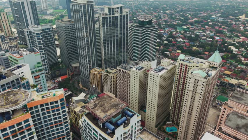 Tall residential and office towers cluster tightly in fast growing Metro Manila