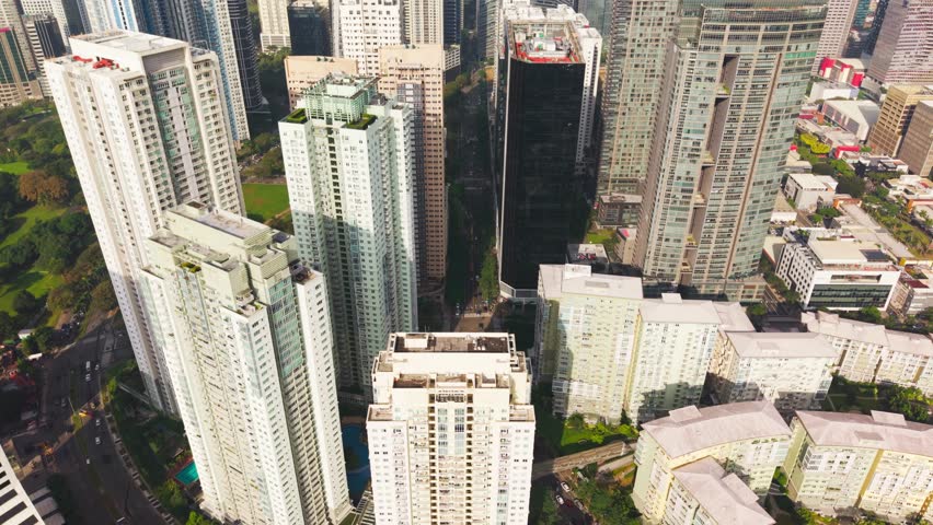 Modern skyscrapers and organized streets show progress of Manila financial hub