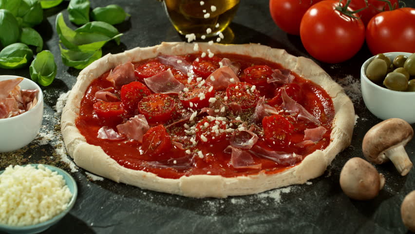 Super Slow Motion of Falling Mozzarella on Pizza Dough . Closeup of Pizza Preparation