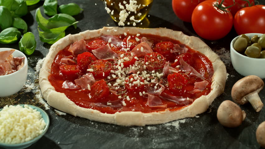 Super Slow Motion of Falling Mozzarella on Pizza Dough . Closeup of Pizza Preparation