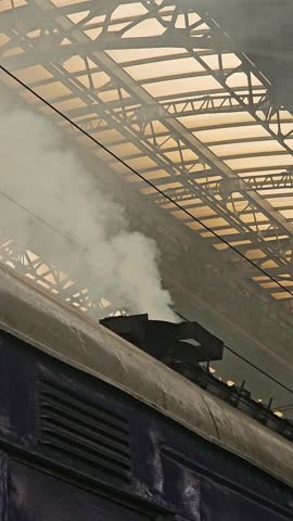 Smoke is coming from the chimney of a train car