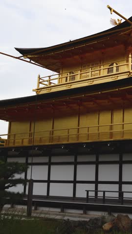 Kinkaku-ji temple golden pavilion, Golden Pavillon garden in Kyoto, Rokuon-ji zen buddhist temple, Japan, Kita-ku Kita ward, autumn fall view, with reflection in a pond, travel to Japan