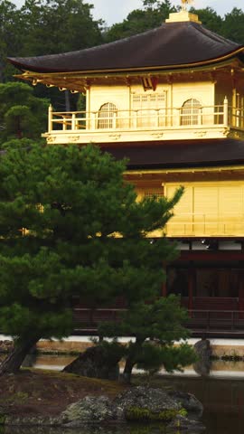 Kinkaku-ji temple golden pavilion, Golden Pavillon garden in Kyoto, Rokuon-ji zen buddhist temple, Japan, Kita-ku Kita ward, autumn fall view, with reflection in a pond, travel to Japan