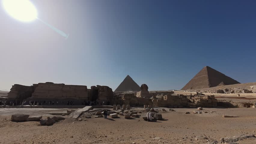 Time-lapse footage of tourists visiting Great Sphinx and Giza Pyramid complex. Giza plateau, Greater Cairo, Egypt. UNESCO World heritage site