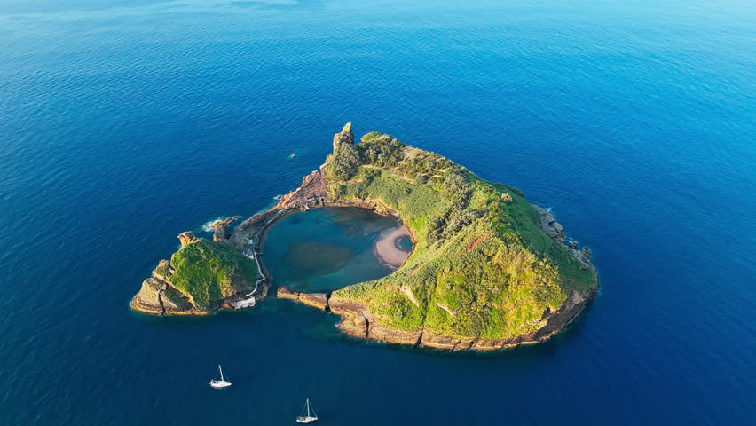 Small island near Sao Miguel island with circle crater lake, Azores, Portugal, Aerial drone view