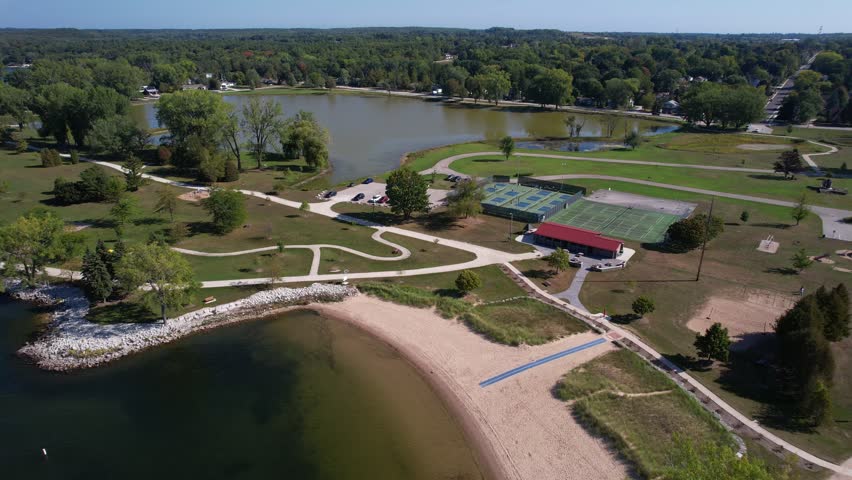 Aerial views during morning hours in Sturgeon Bay, located in Door County Wisconsin.  Push Drone shot of Pickleball courts.